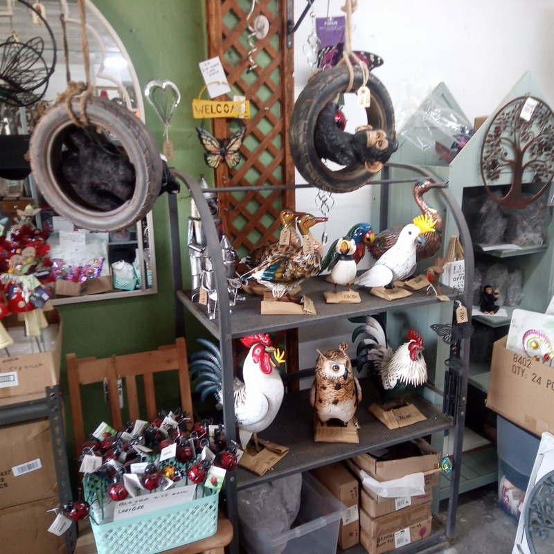 inside one of our sheds rammed with cheap giftware and chimp gorilla in tyre